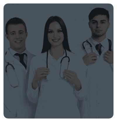 Group of doctors smiling and wearing lab coats.